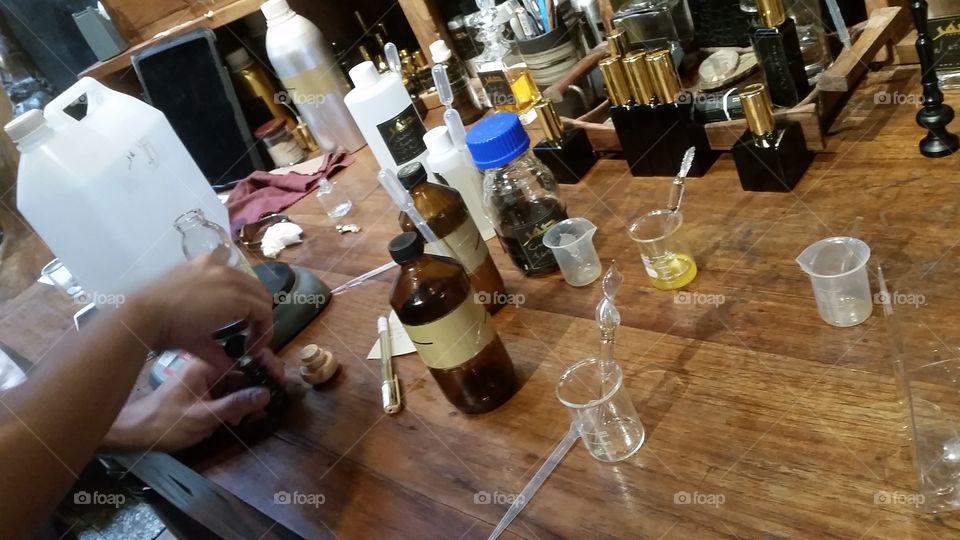 tools of the trade. aromatherapist blending at his work station