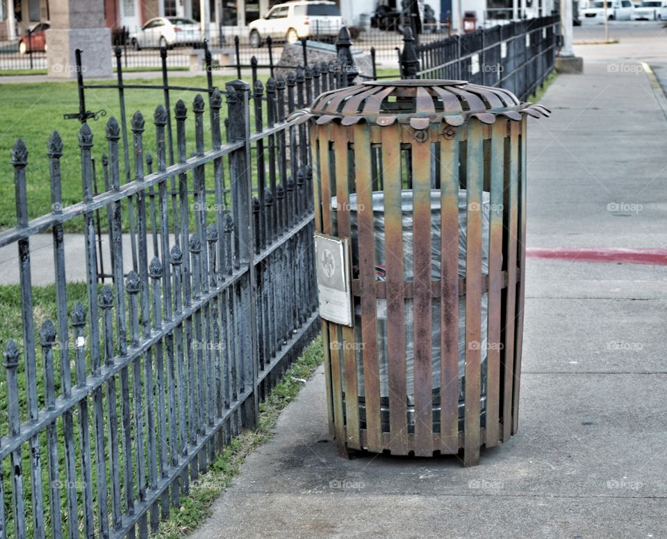 Perfectly rusted trash receptacle. 