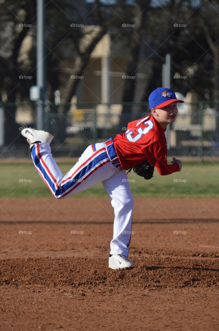 11 year old baseball player pitching.. 11 year old baseball player pitching. Big dreams of going to the Show!