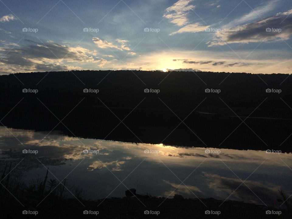 Reflections. This was taken one summer evening as the sunset behind the mountain at the lake.