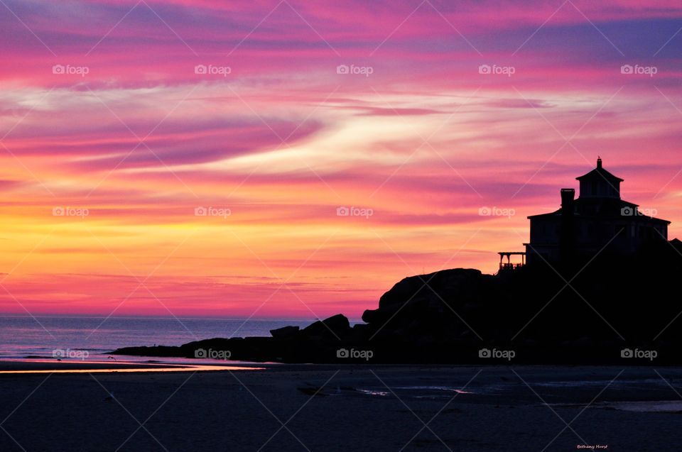 Silhouette of lighthouse during sunset