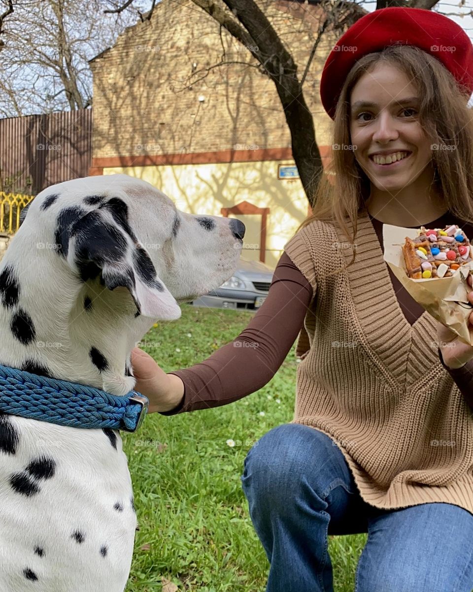 Summer in the city with puppy Dalmatian 
