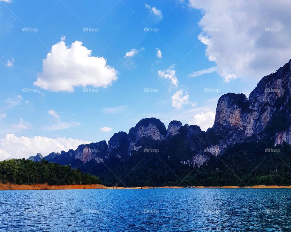 Scenic view of lake against mountain range
