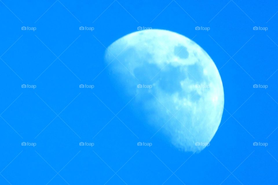 The moon in a blue sky 