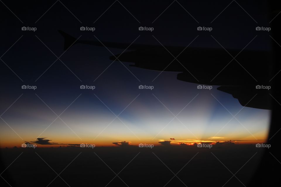 Sunrise on the plane. Stunning sunrise view on the plane