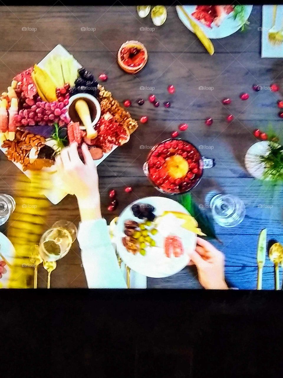 fixing a party tray of fruit