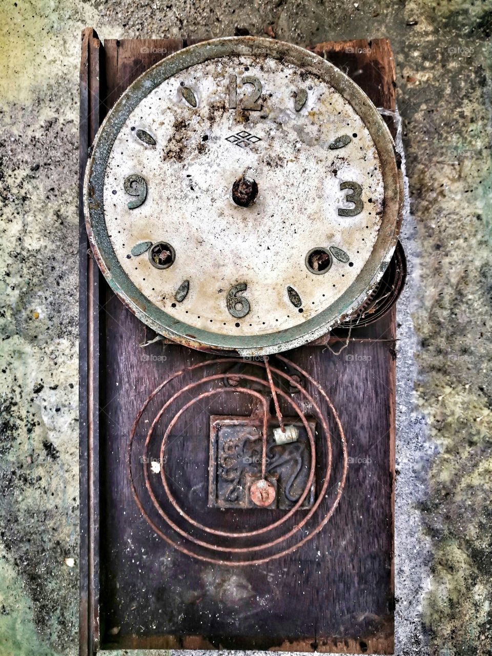 Old and damaged clock on wall