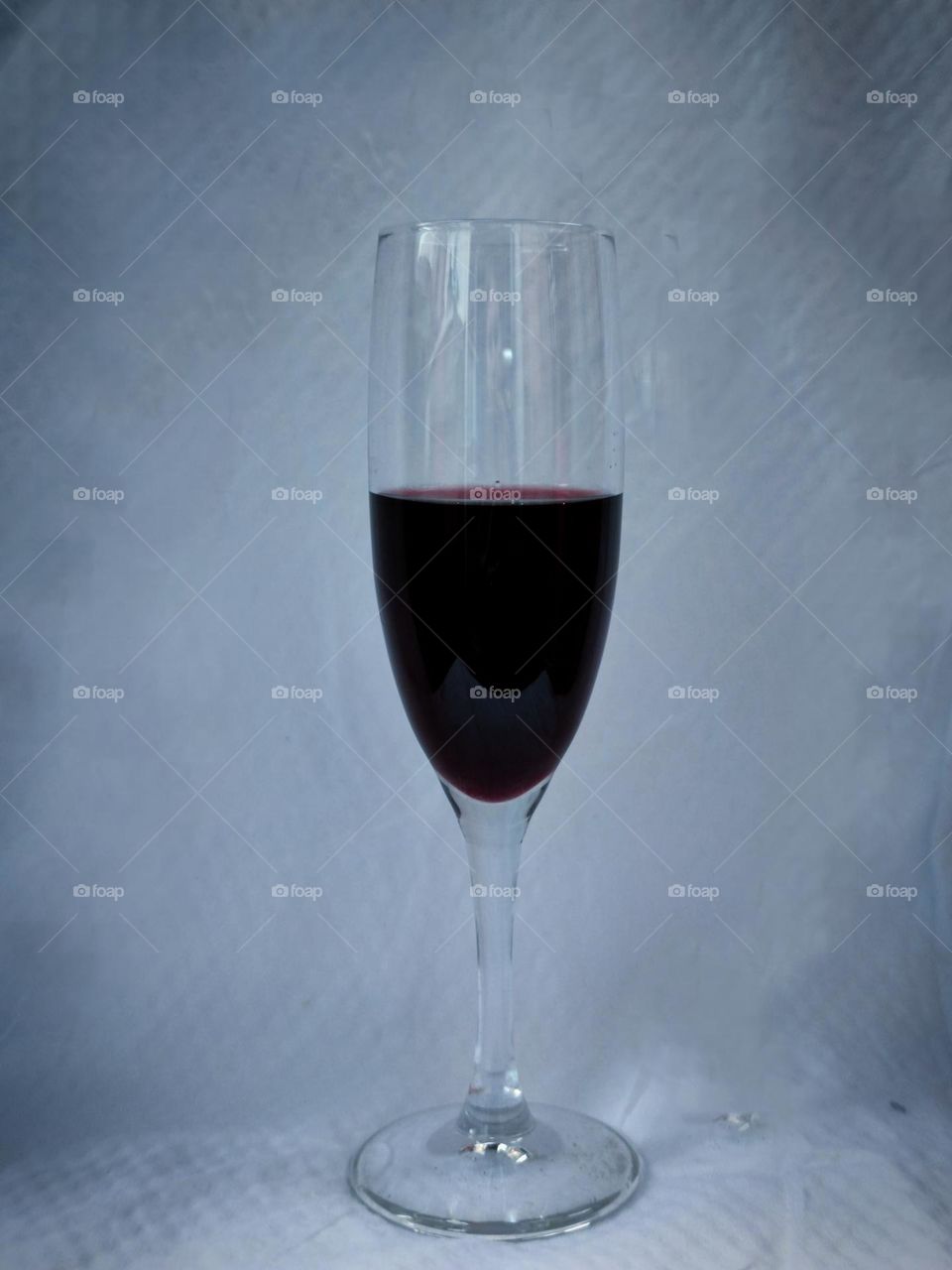 Minimalism.  Glass with red wine.  Optimism or pessimism.  The glass is half full or the glass is half empty