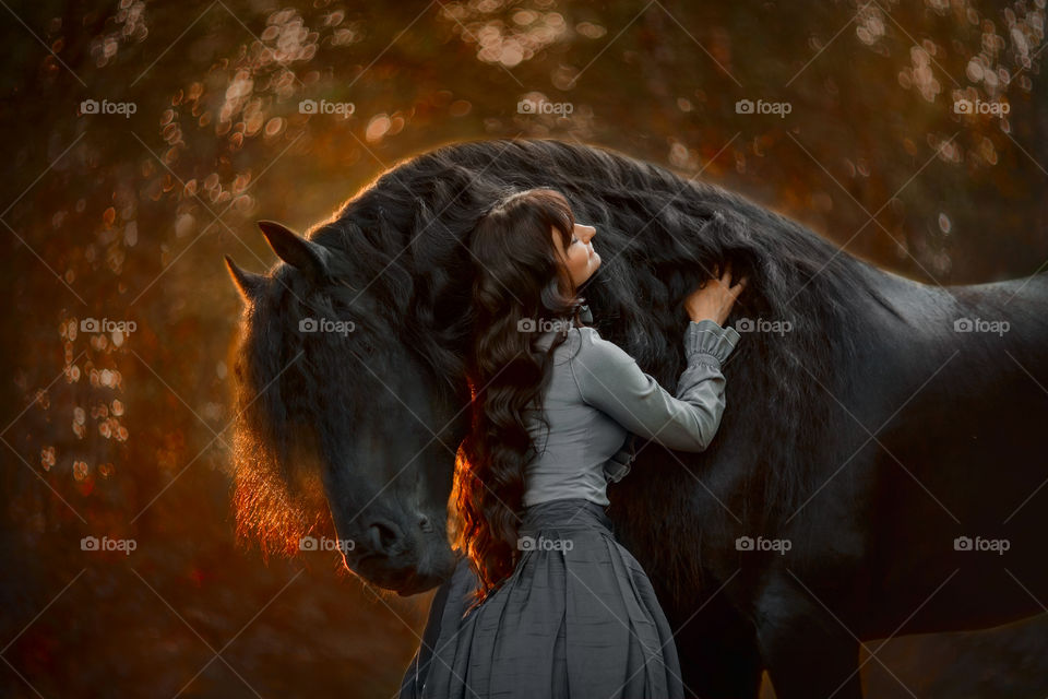 Beautiful young woman with horse