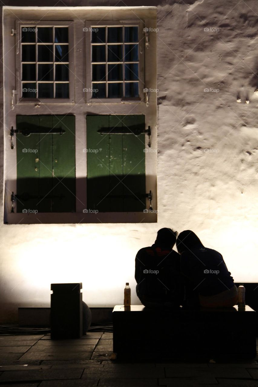 A portrait of a typical Dutch colonial legacy from an old building, namely windows in a typical European style.