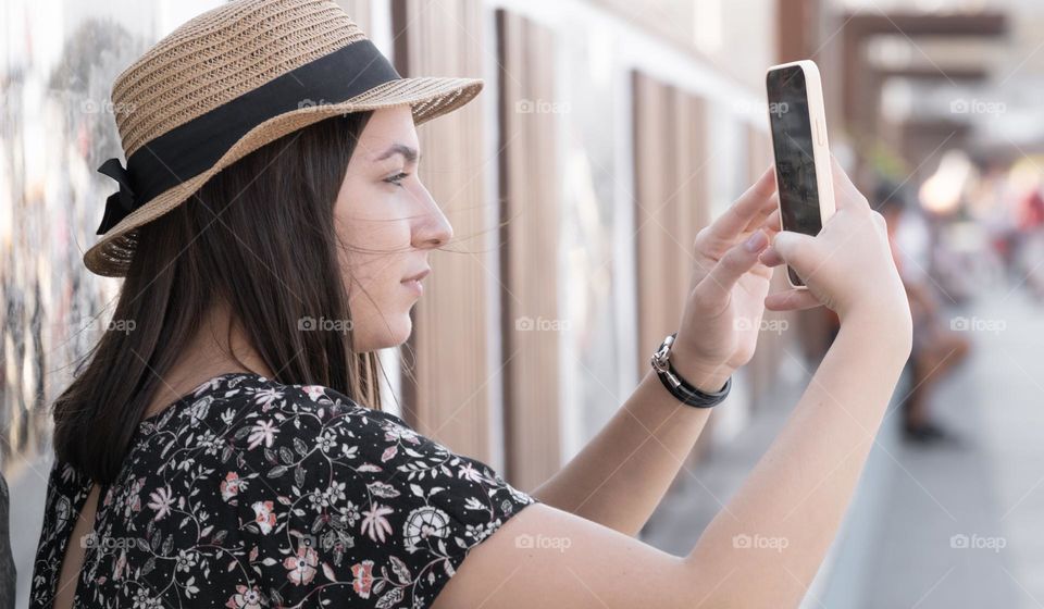 An young woman taking photos 