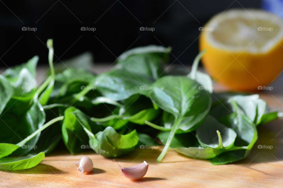 Basil and garlic on cutting board