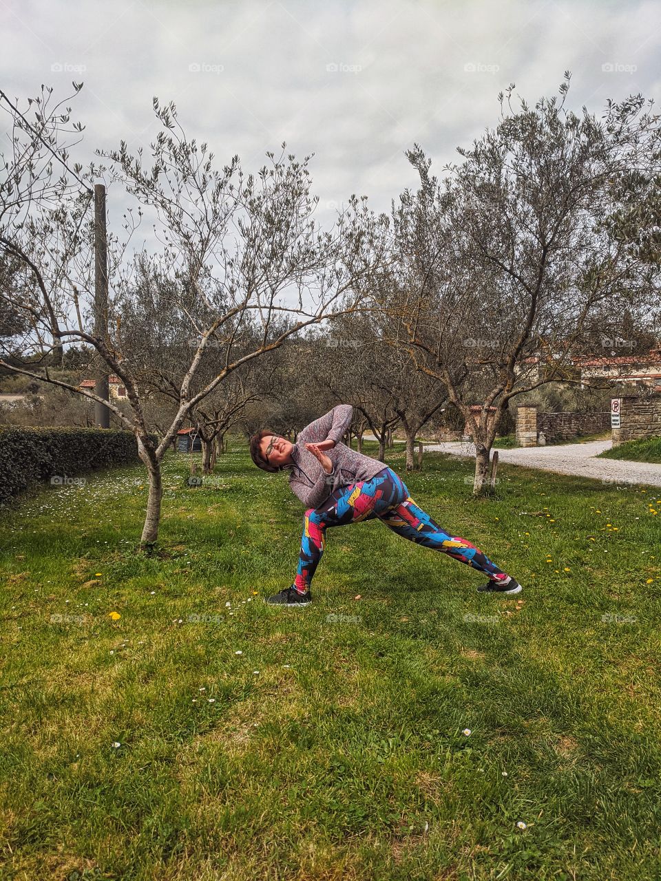Portrait of beautiful young smiling woman doing yoga poses at the nature at spring. Healthy lifestyle