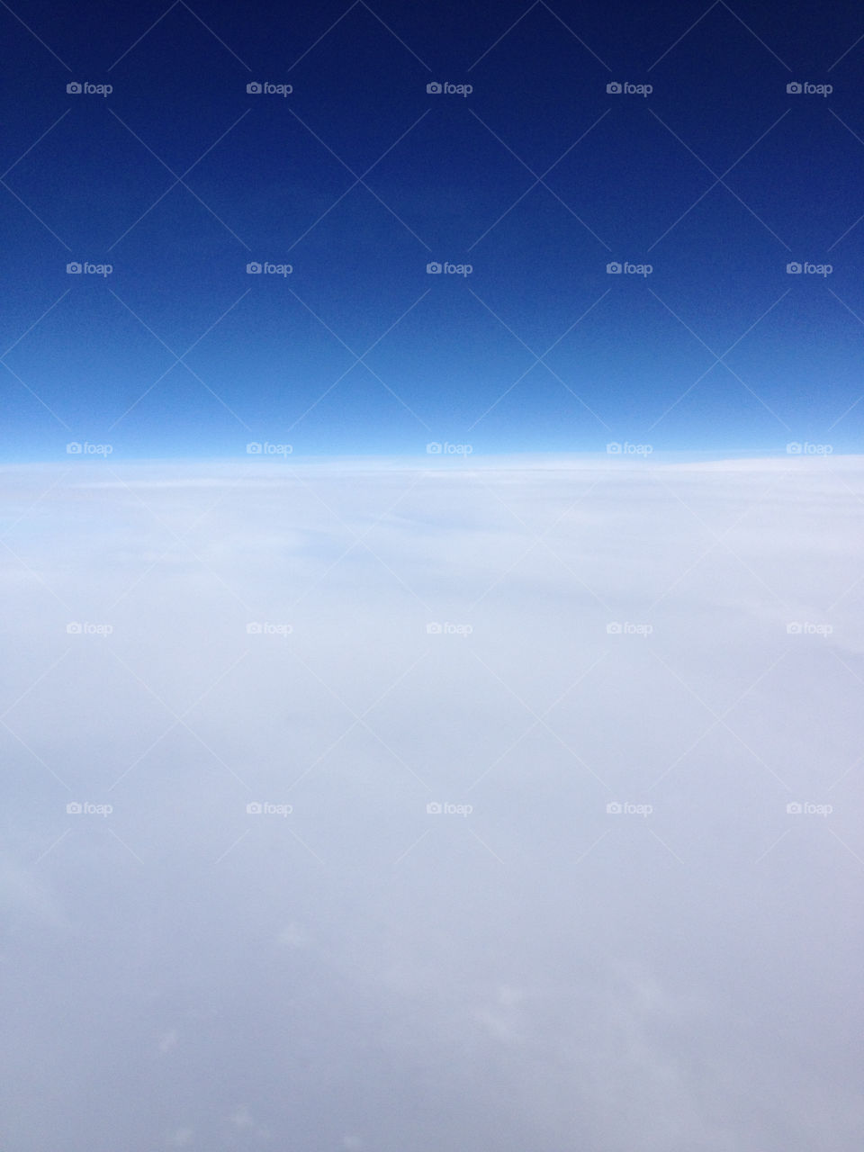 White soft clouds and blue infinite sky