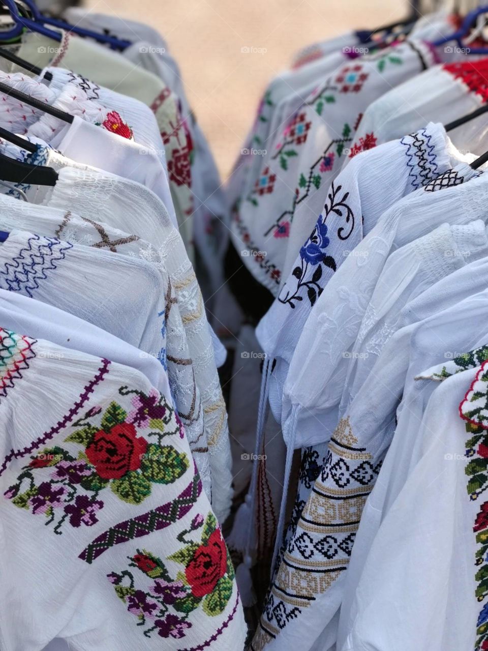 Close up view of embroidered Romanian and Moldavian traditional blouses