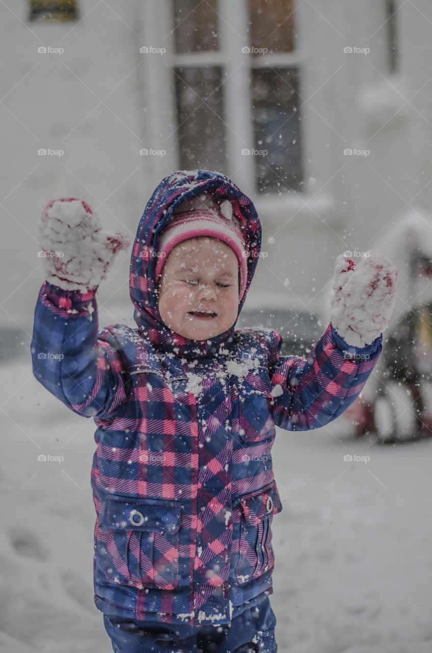 Boy playing in winter season