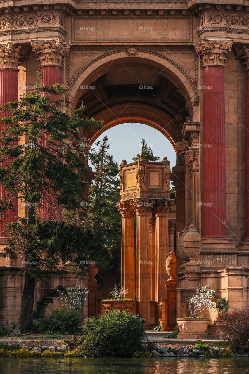 Detail view of the Palace of Fine Arts in San Francisco California, with its Greco Roman architecture and stunning columns and arches, as viewed through the dome