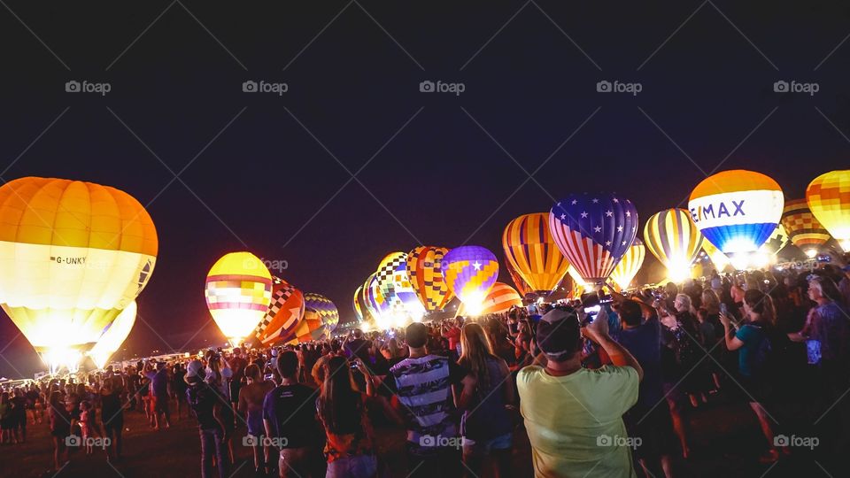 The Balloon Glow at the Great Texas Balloon Race, a field of hot-air balloons lit up at night