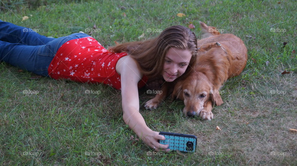 I am the one in this picture with this gorgeous golden retriever named Molly. Molly was up for adoption at the time of this picture so I decided to promote her adoption by using her in my senior pictures. Molly got adopted just soon after this picture was taken. She enjoyed everything and was a very good dog for selfies.🐶