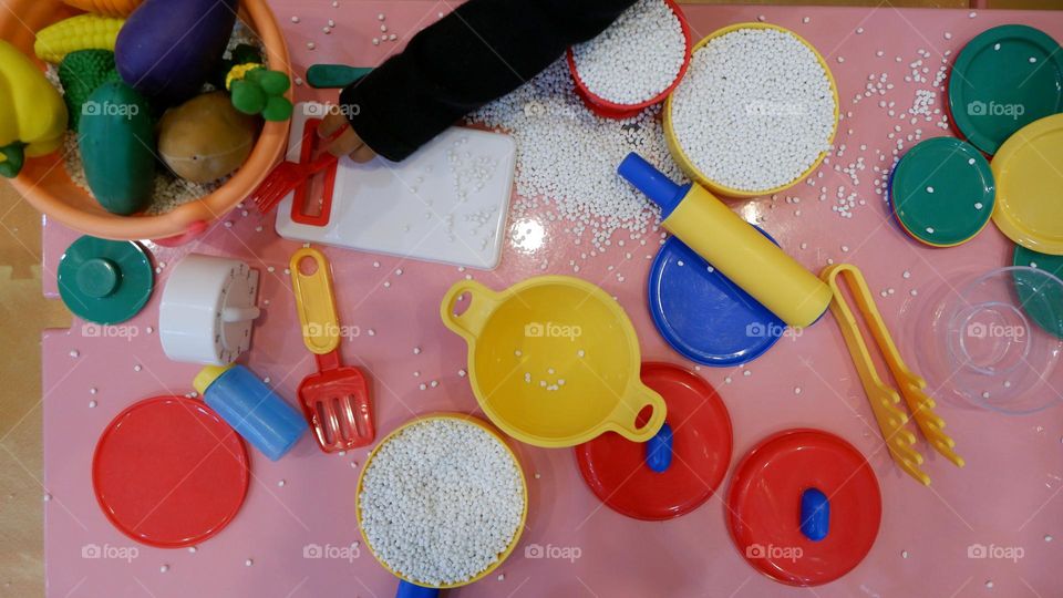 Plastic toy cooking utensils for children to play.