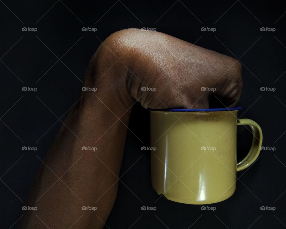 fingers are inside the mug