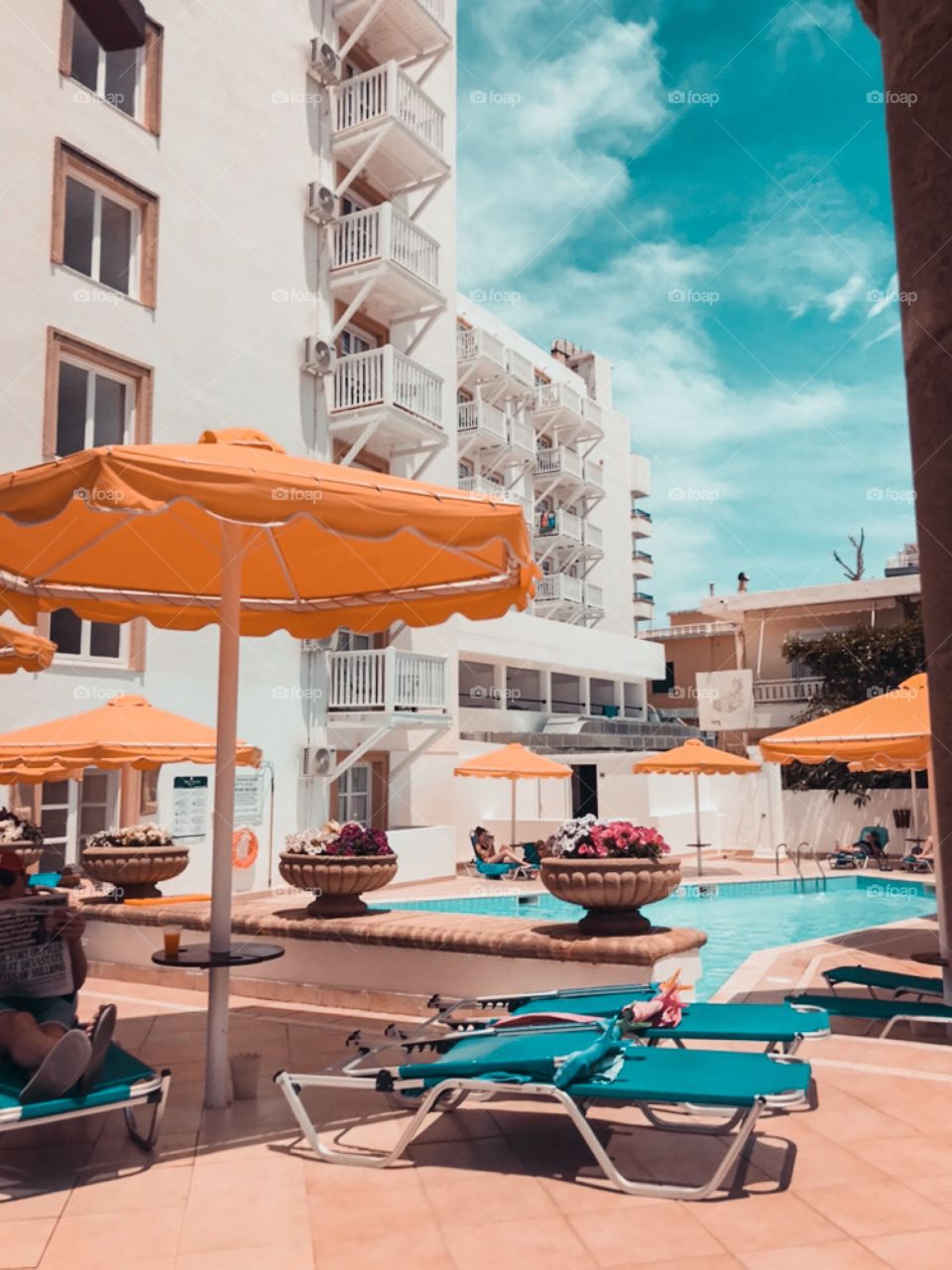 Umbrellas and chairs in a hotel swimming pool