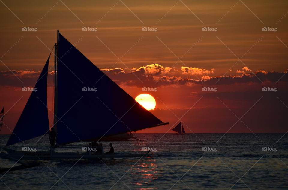 Sailing during sunset in the Philippines