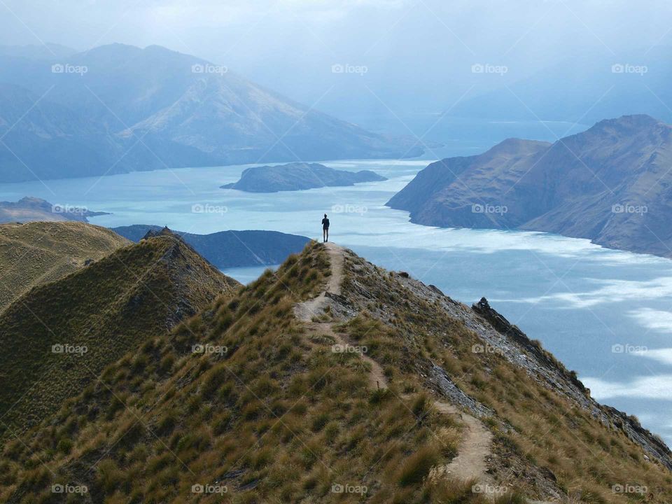 person on top of the Roy's peak track