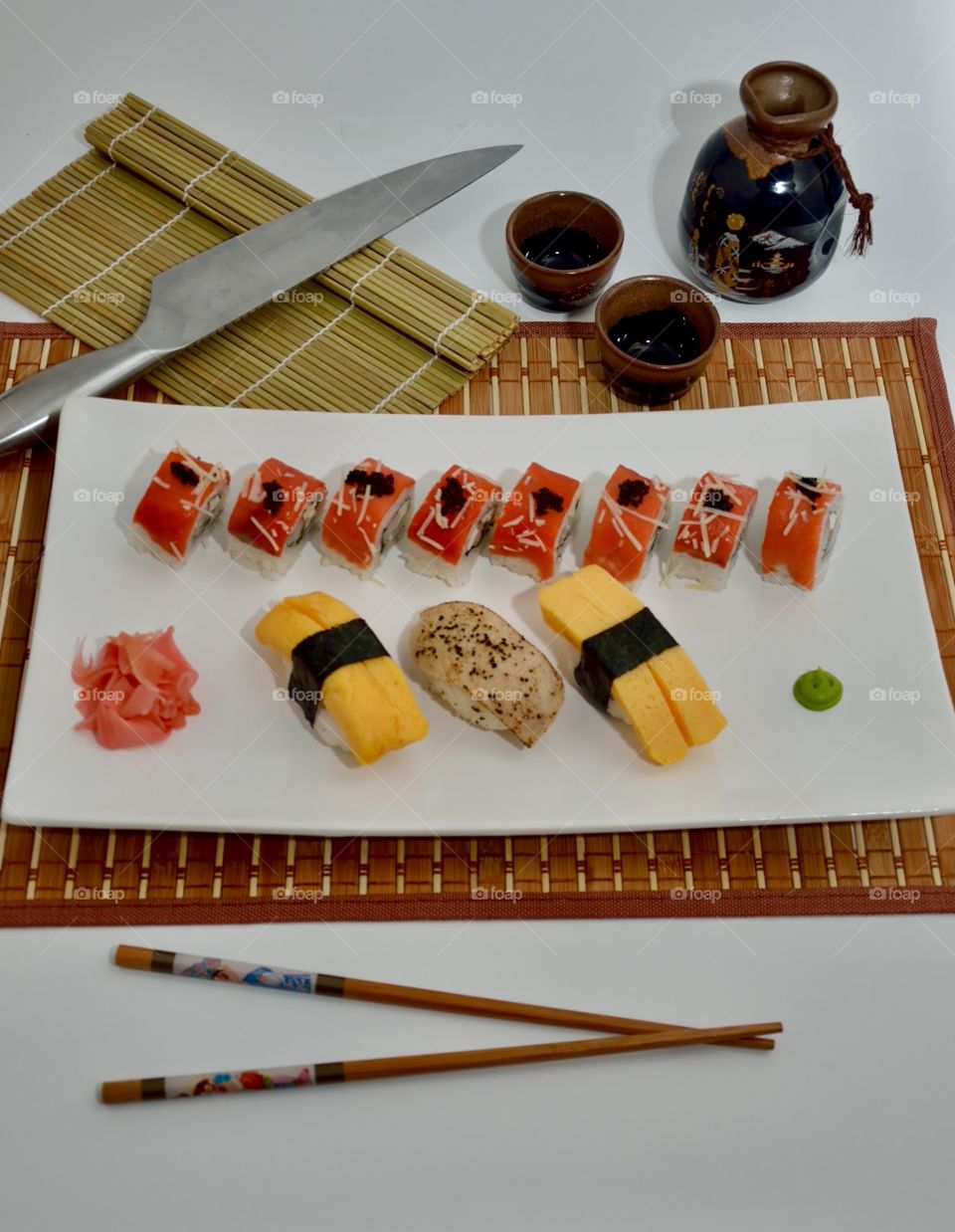 Smoked Salmon Roll topped with black tobiko and parmesan cheese, along with the classic Tamago and Tuna Tataki sushi. The ultimate Asian cuisine treat! 