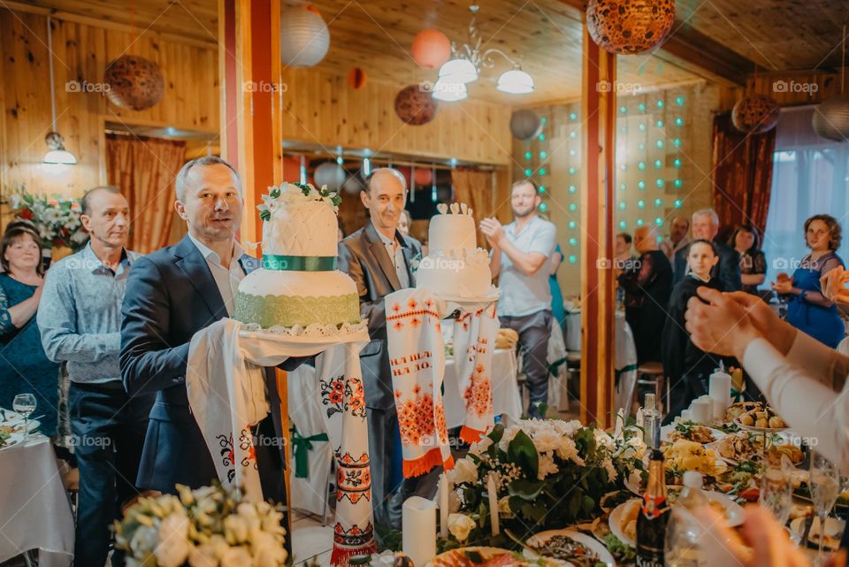 Godparents with a wedding loaf