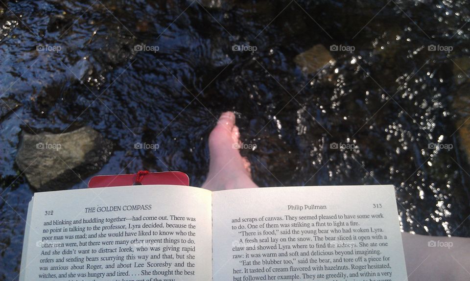 Quiet time to read by a stream
