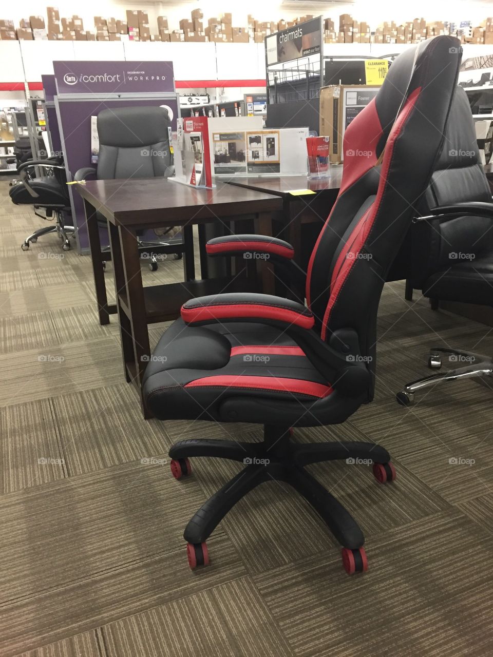 Black and red office chair in an office store. 