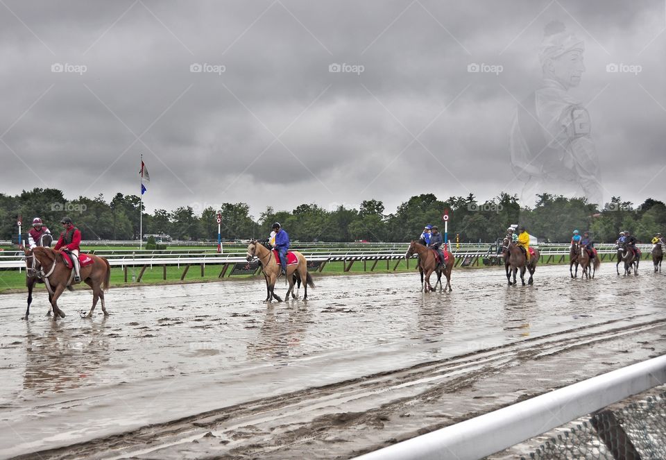 Remembering the Past. On a raining overcast day, the horses are called to the post at Saratoga.  Current jockeys are reminded of past greats.