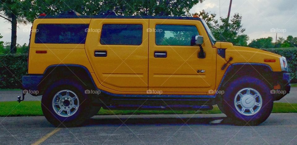 Yellow Hummer humming!. Yellow Hummer parked 