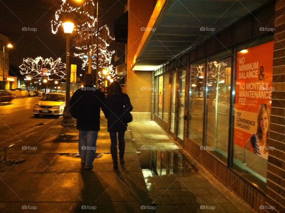 Walking down the street in the city lights 