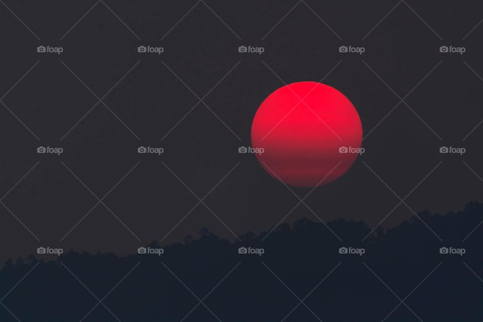 Red ball in darkness