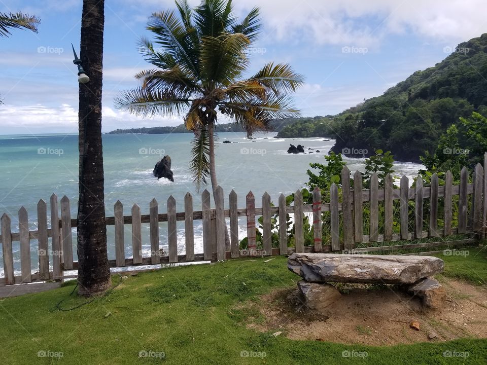 The view overlooking Hosanna resort on the eastern end of the tropical island of Trinidad. This piece of the tropical and beautiful cake is a must go to if you wish to experience the sandy beach below this point.