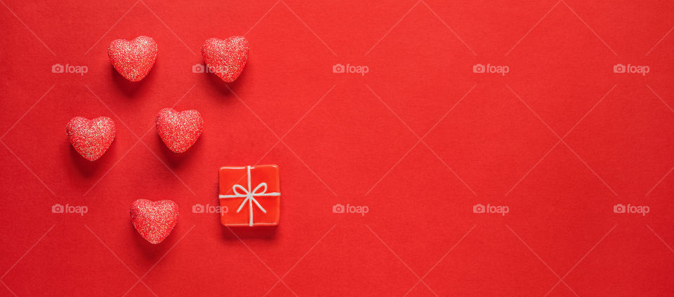 Postcard. Red hearts on a red background. Valentine's Day.