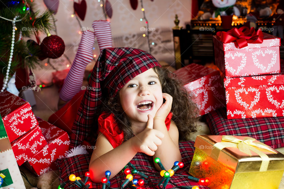Happy young girl with christmas gifts