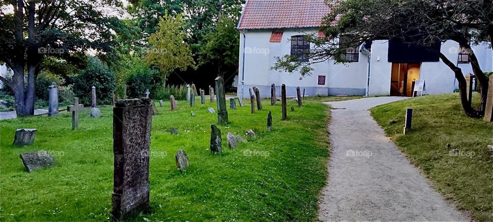 This is the cemetery next to the “Inselkirche”, the “Island Church” on the island “Hiddensee” in the “Baltic Sea” or “Ostsee” in “Mecklenburg - Western Pomerania”, Germany. 2024. Hypnotic Productions