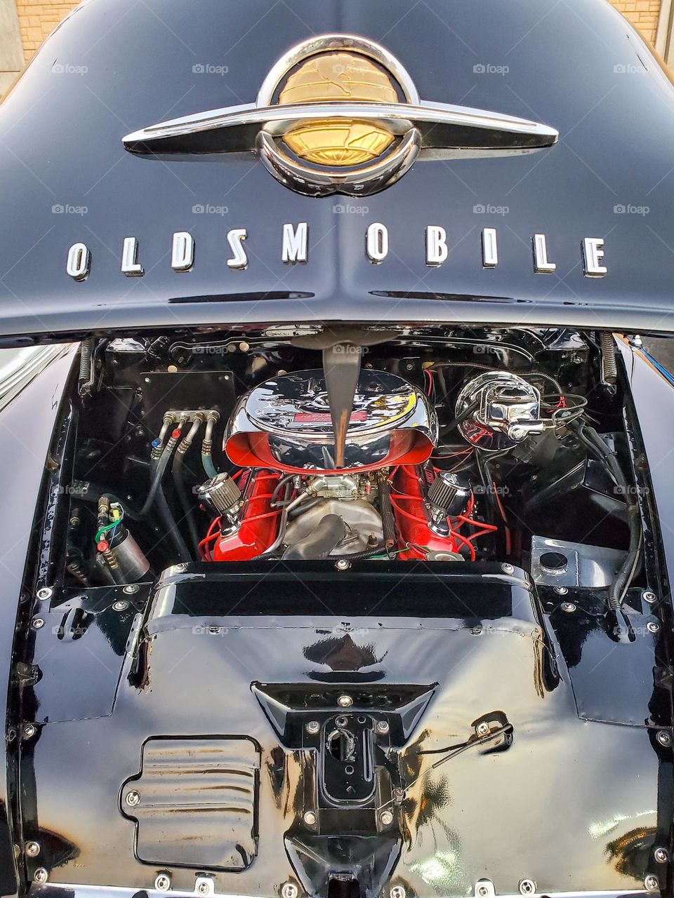 A classically restored Oldsmobile with a Rocket engine