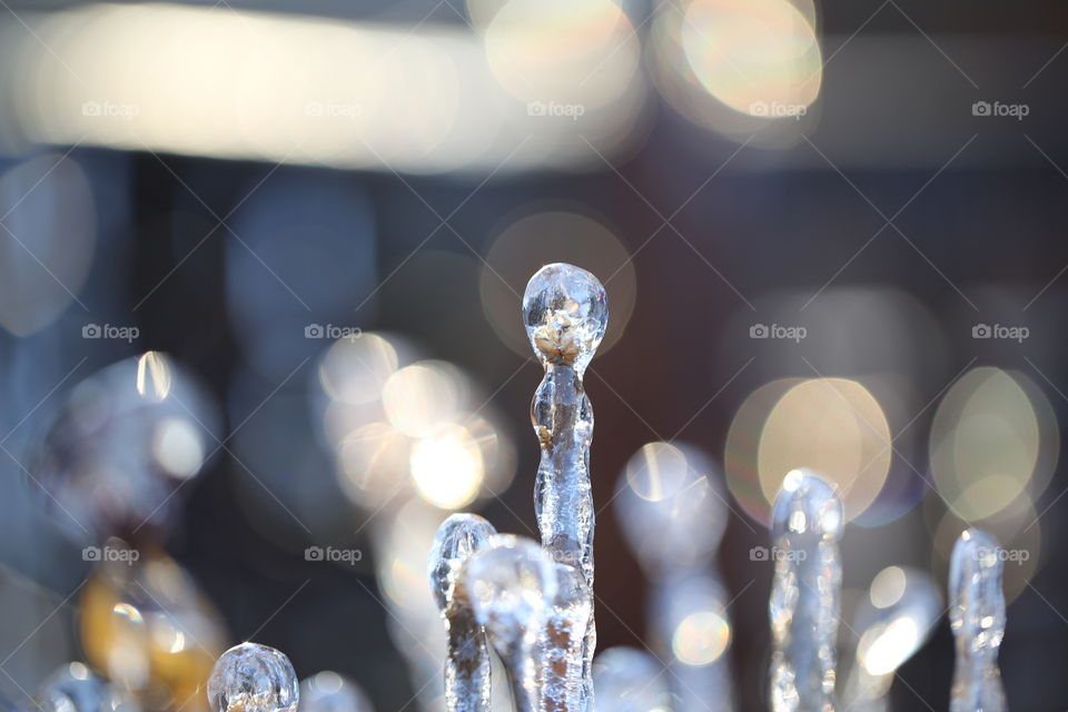 Creatively shaped icicles with bokeh light and beautiful colours
