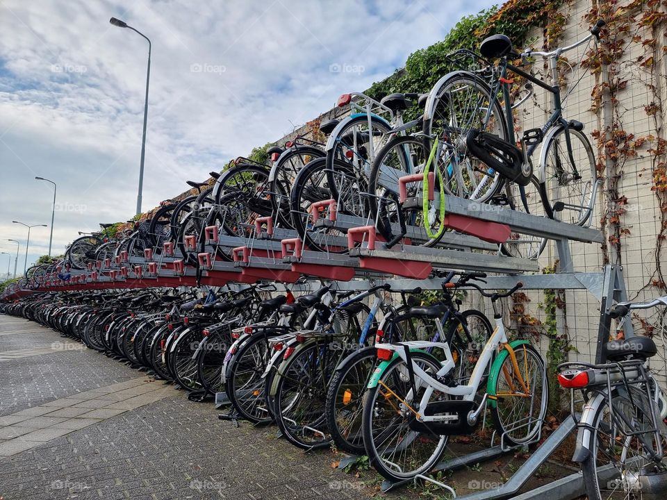 Two-level bicycle parking with long rows of bicycles