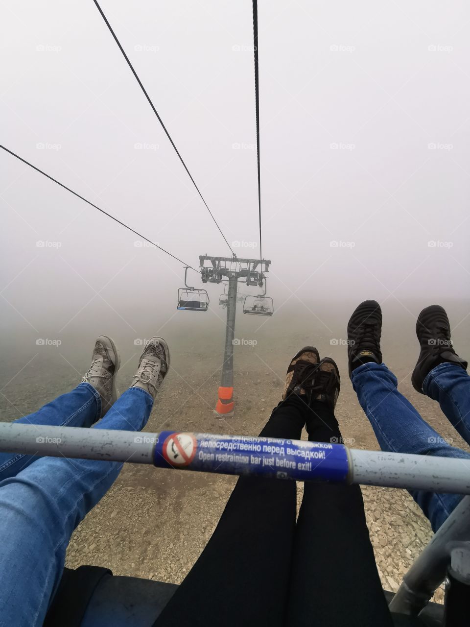 From up to above feet legs mountains hills field nature view eco focus day part sun sunny travel Light reys trip form plant part shades shape beauty greens outdoor freedom happy happiness fog foggy cable car
