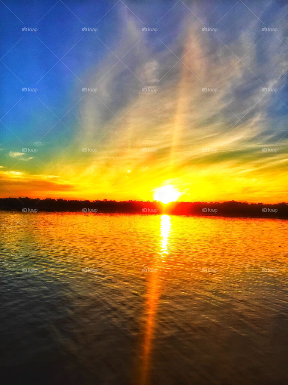 Sunlight over sea during sunset
