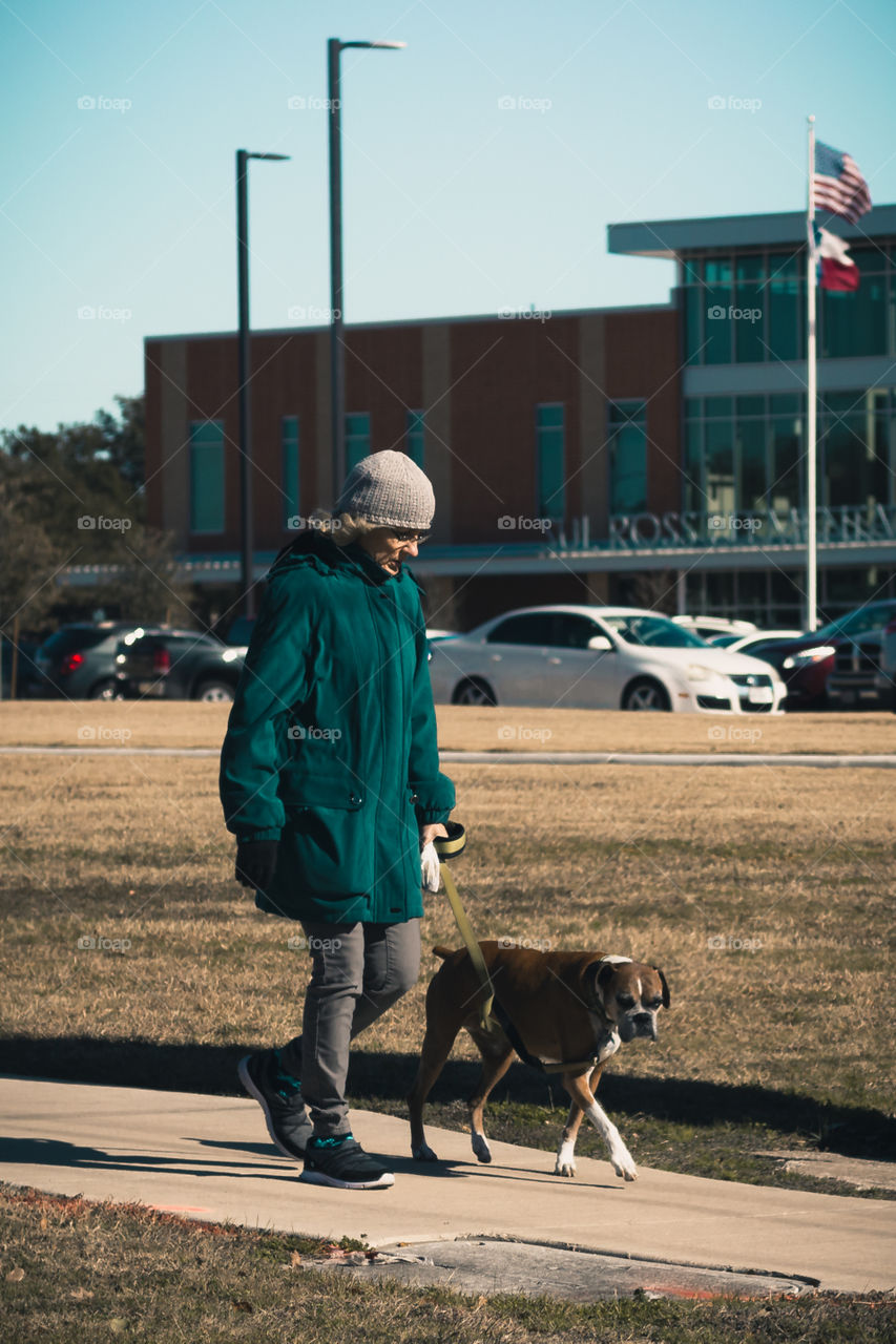 Woman Walking a Dog
