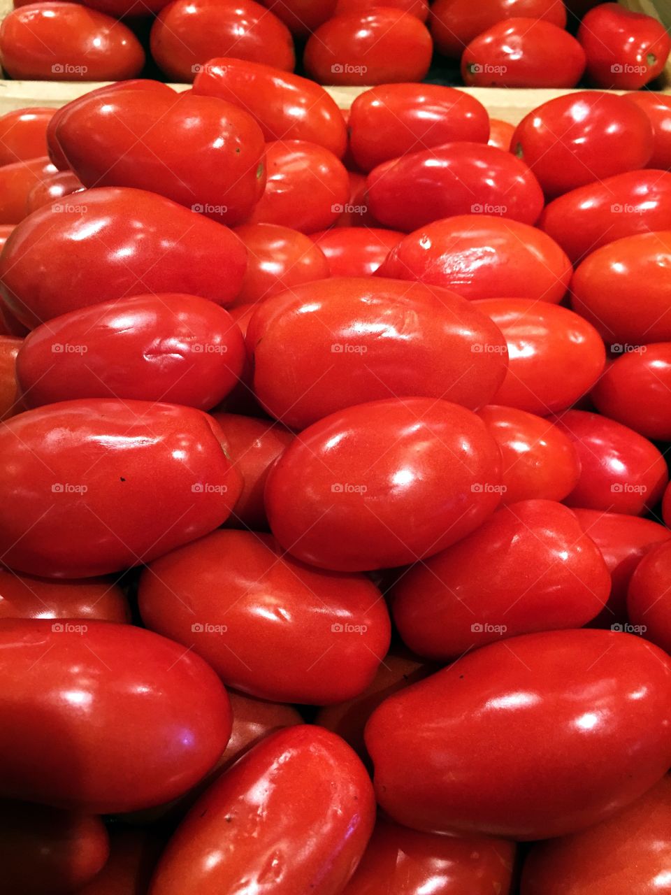 Tomatoes. A selection of delicious ripe red Roma tomatoes.