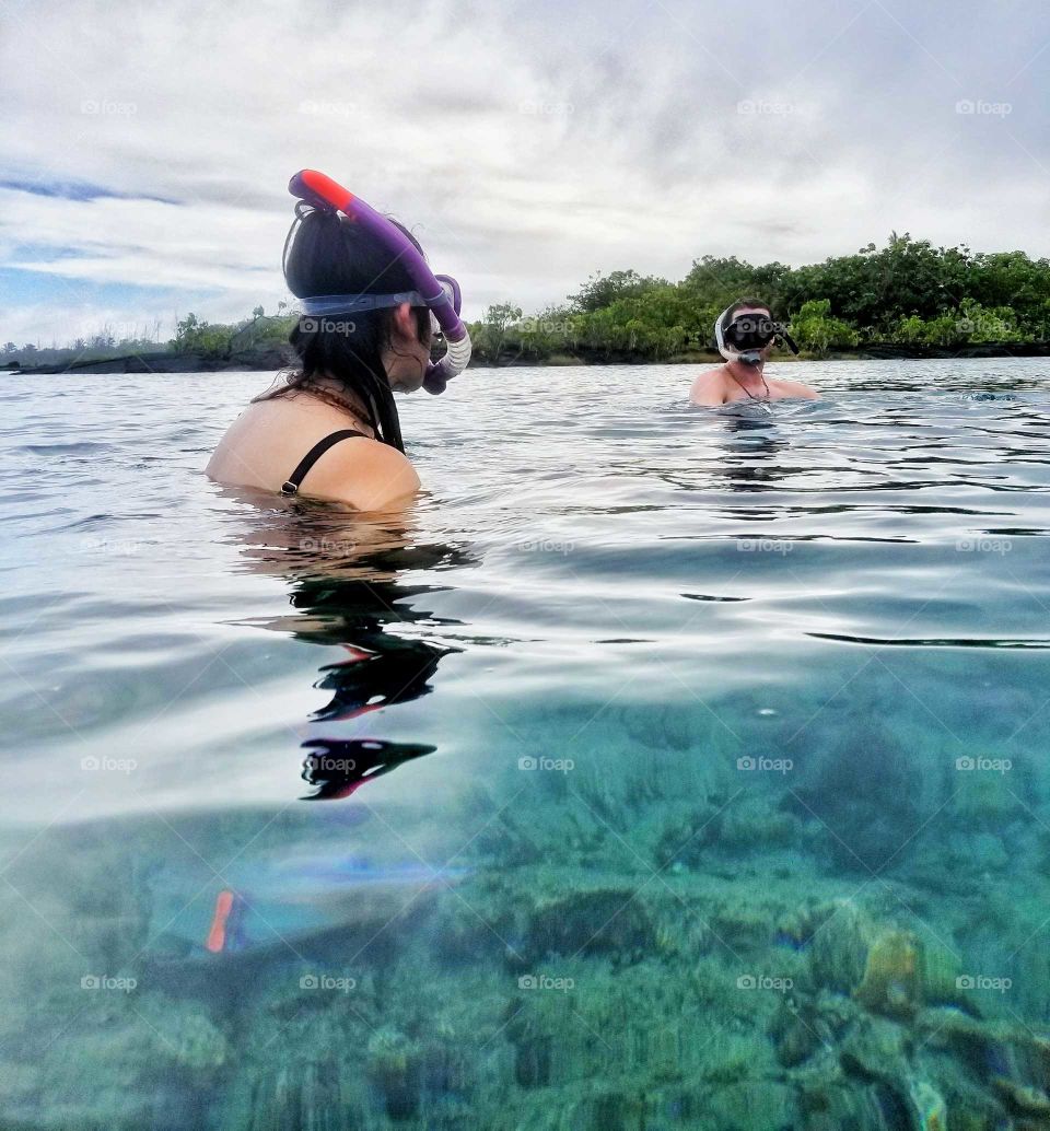 first timer snorkeling in the beautiful scenic waters of Kapoho Bay that sadingly is no longer...due to volcano lava eruption in Hawaii.