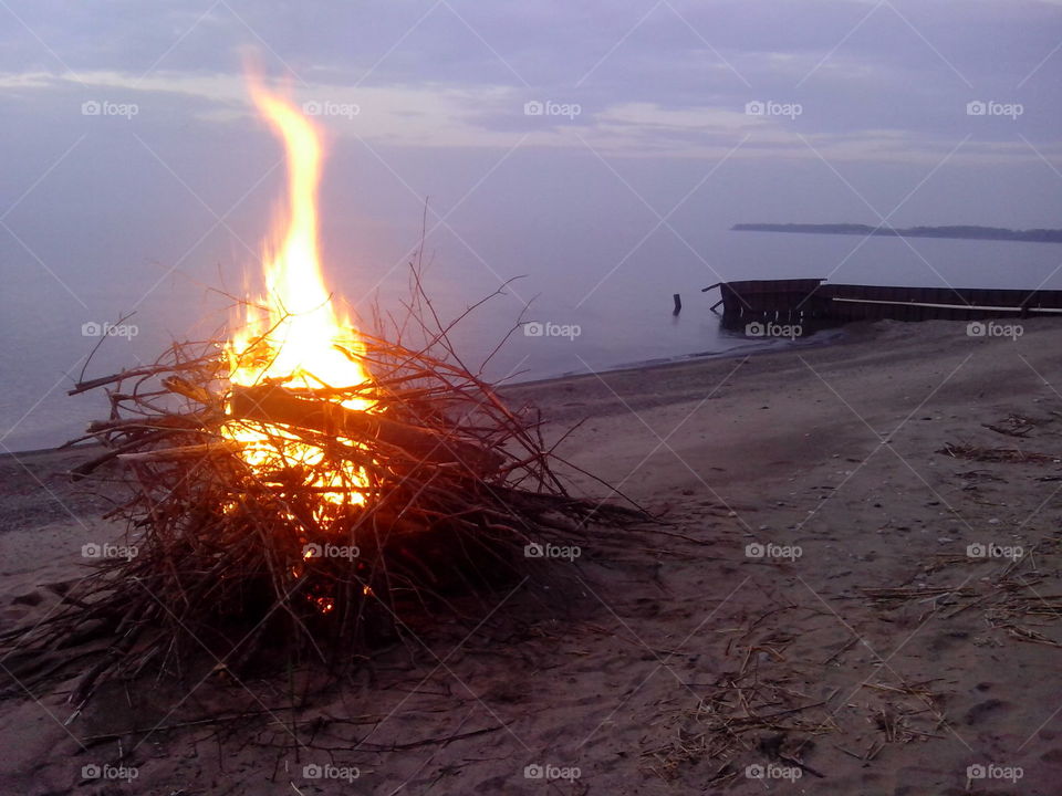 Bonfire on the beach at the lake