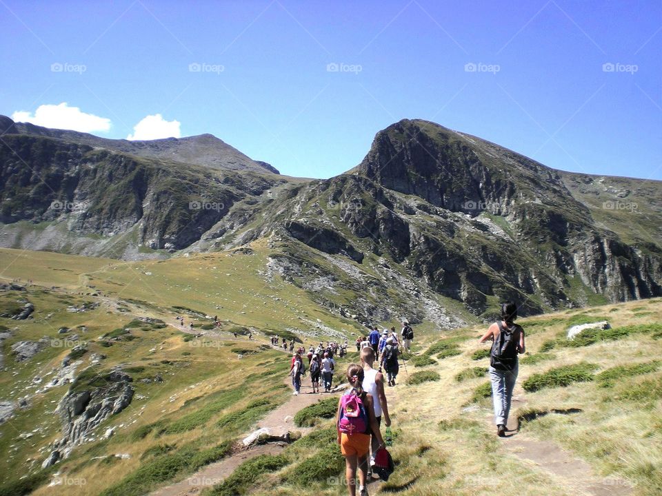 Summertime, people walking at the mountain